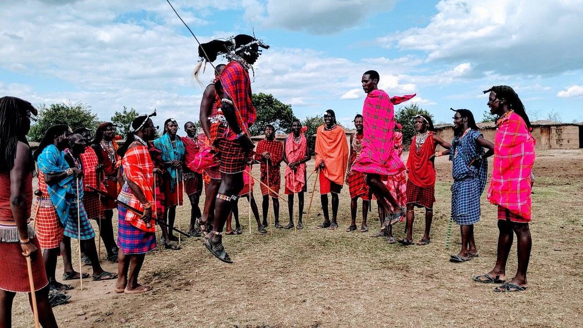 An incentive group watching a Maasai jumping dance in Kenya