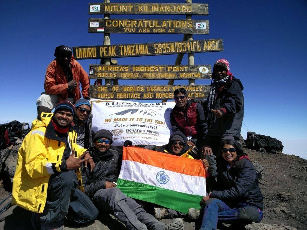 The TokenLinx group at Uhuru Peak, the summit of Kilimanjaro